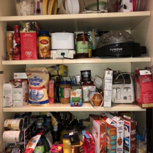 Deep pantry before organizers in Webster came